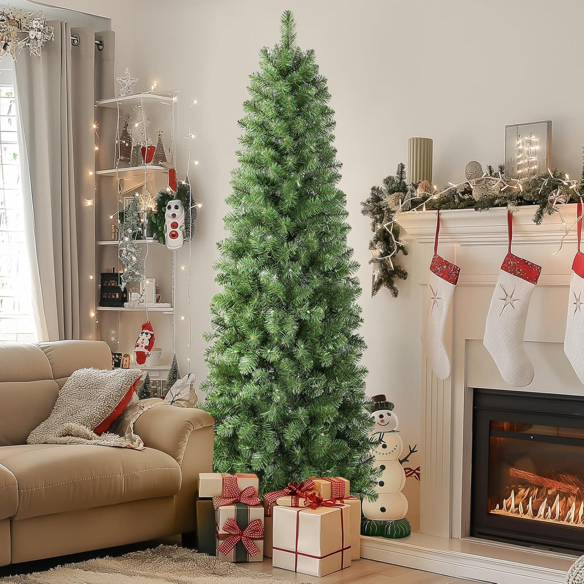 Green pencil Christmas tree shown with its lights off beside a mantel and wrapped gifts.